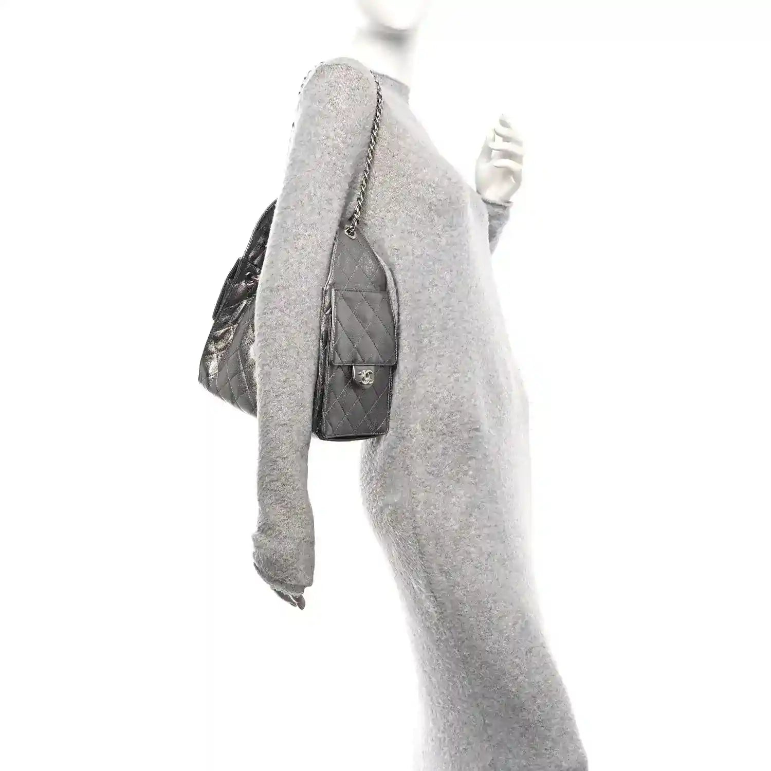 Chanel metallic quilted handbag worn on shoulder with side flap pocket