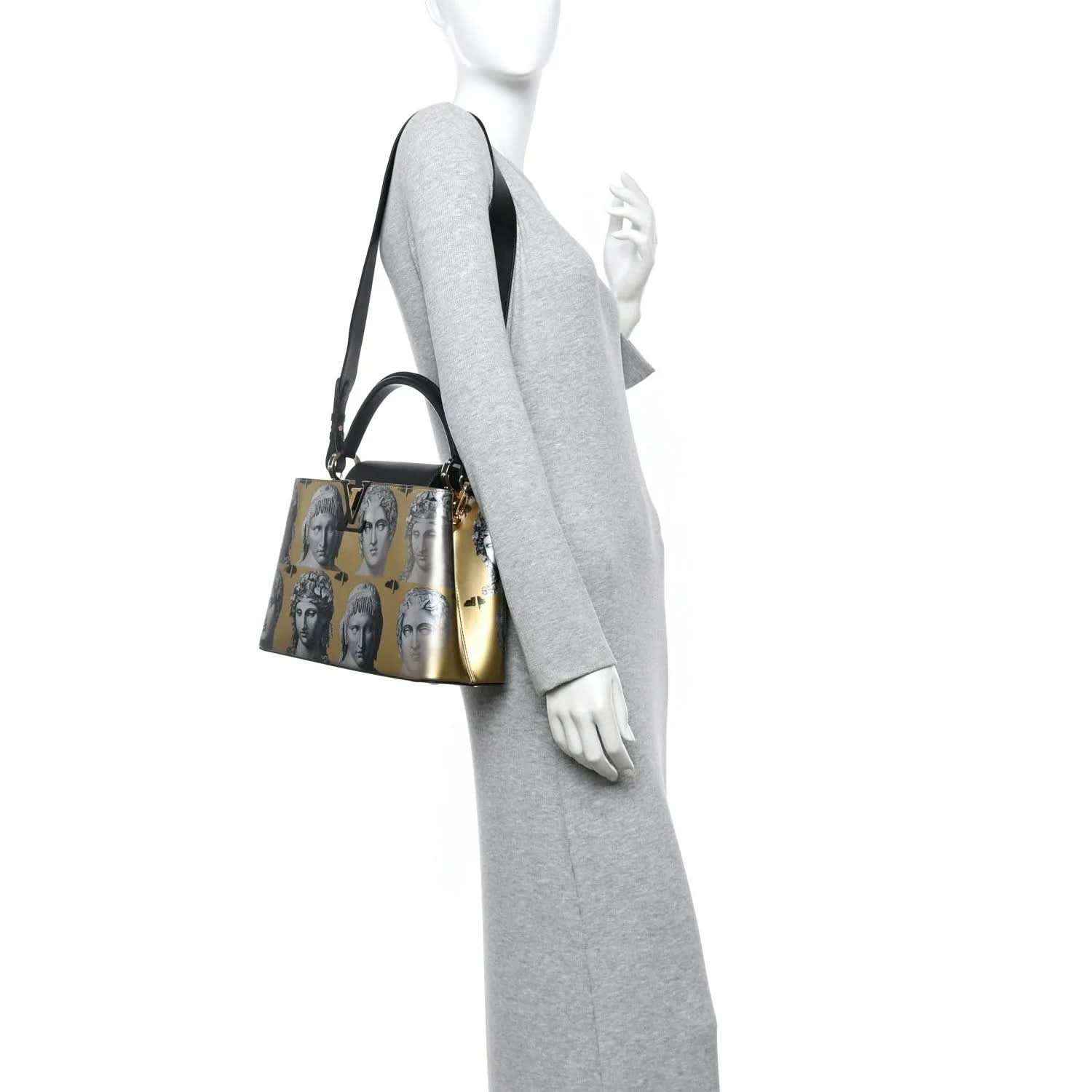 Calfskin handbag with gold face-print panel, black shoulder strap, and small gold hardware