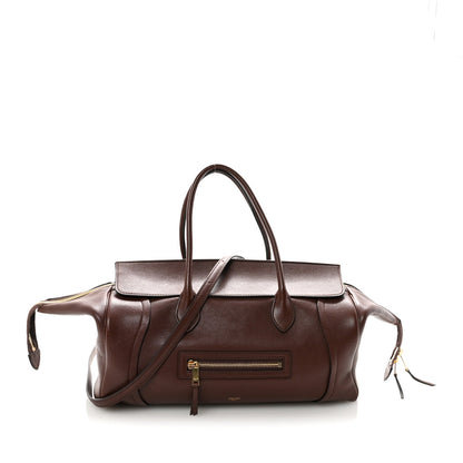 Shiny lambskin medium handbag in dark brown with top handles and front zip pocket