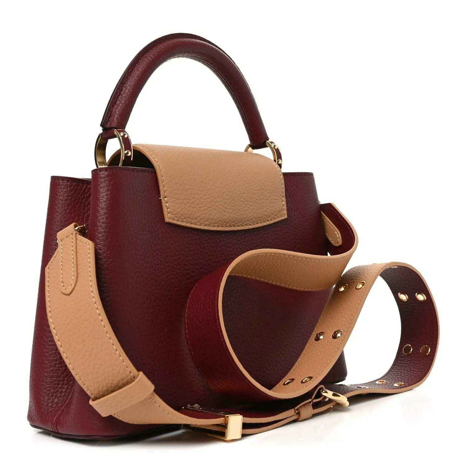 Bordeaux leather mini handbag with tan handles, crossbody strap, and gold hardware.