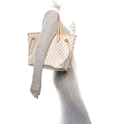 Louis Vuitton Damier Azur checkered tote bag with pink leather handles and pouch