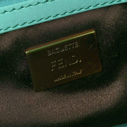 Turquoise leather lining with FENDI logo metal plaque inside baguette bag