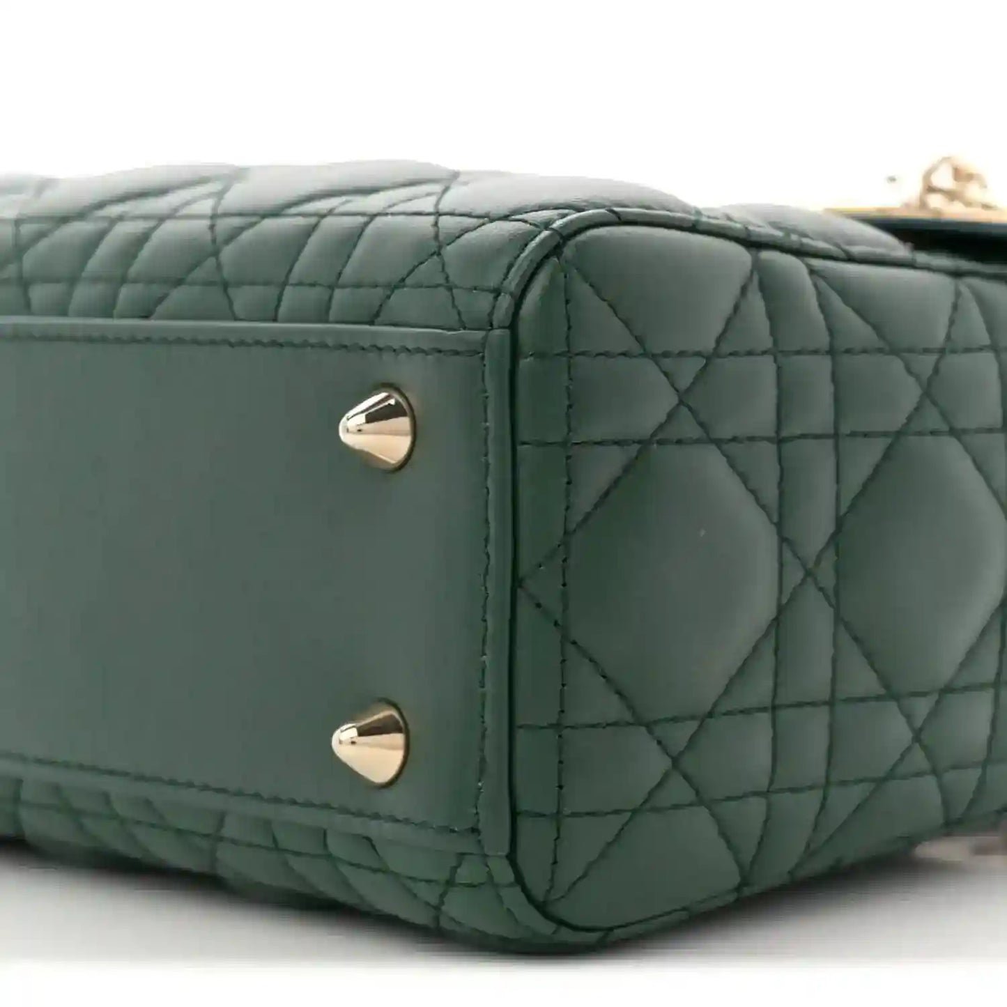 Green quilted lambskin Lady Dior bag side with two silver stud feet