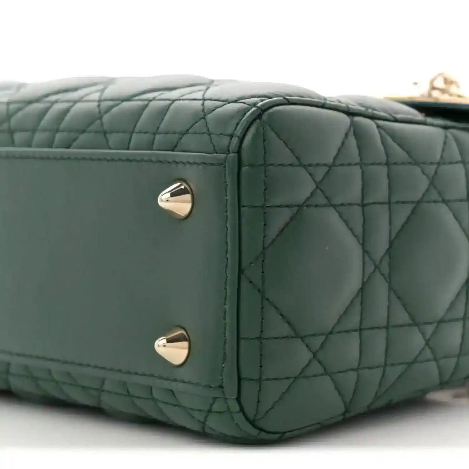 Green quilted lambskin Lady Dior bag side with two silver stud feet