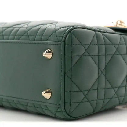Green quilted lambskin Lady Dior bag side with two silver stud feet