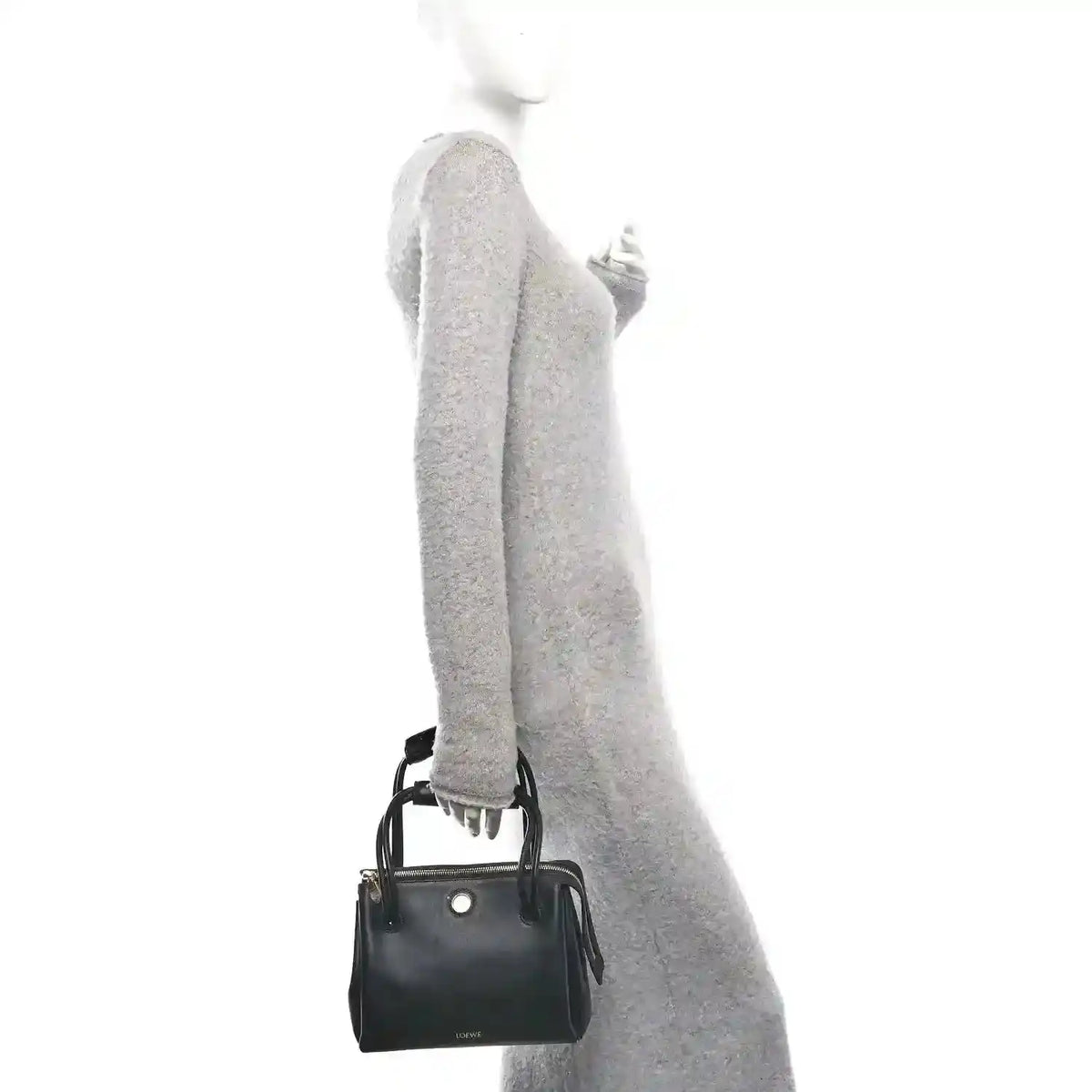 Small black leather handbag with top handles and shoulder strap