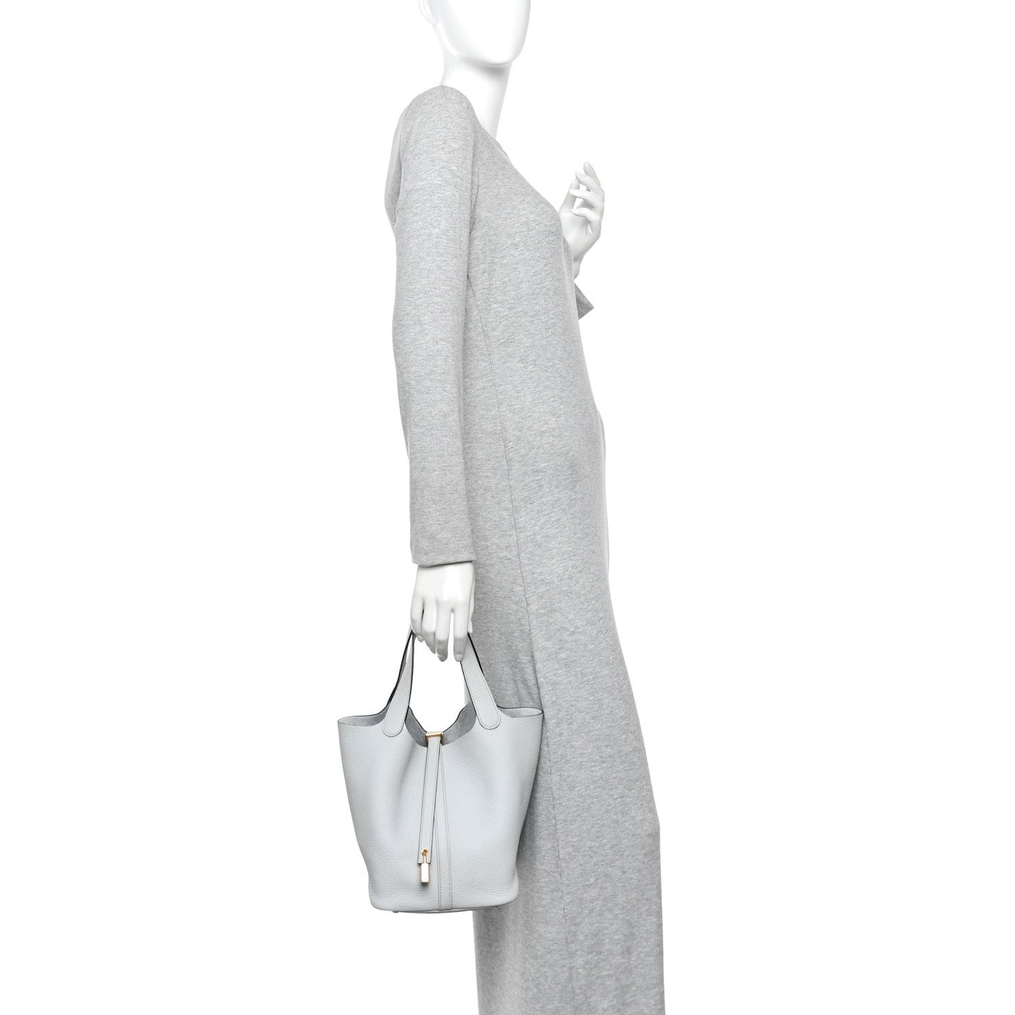 Light blue pebbled leather bucket tote with short handles and lock front