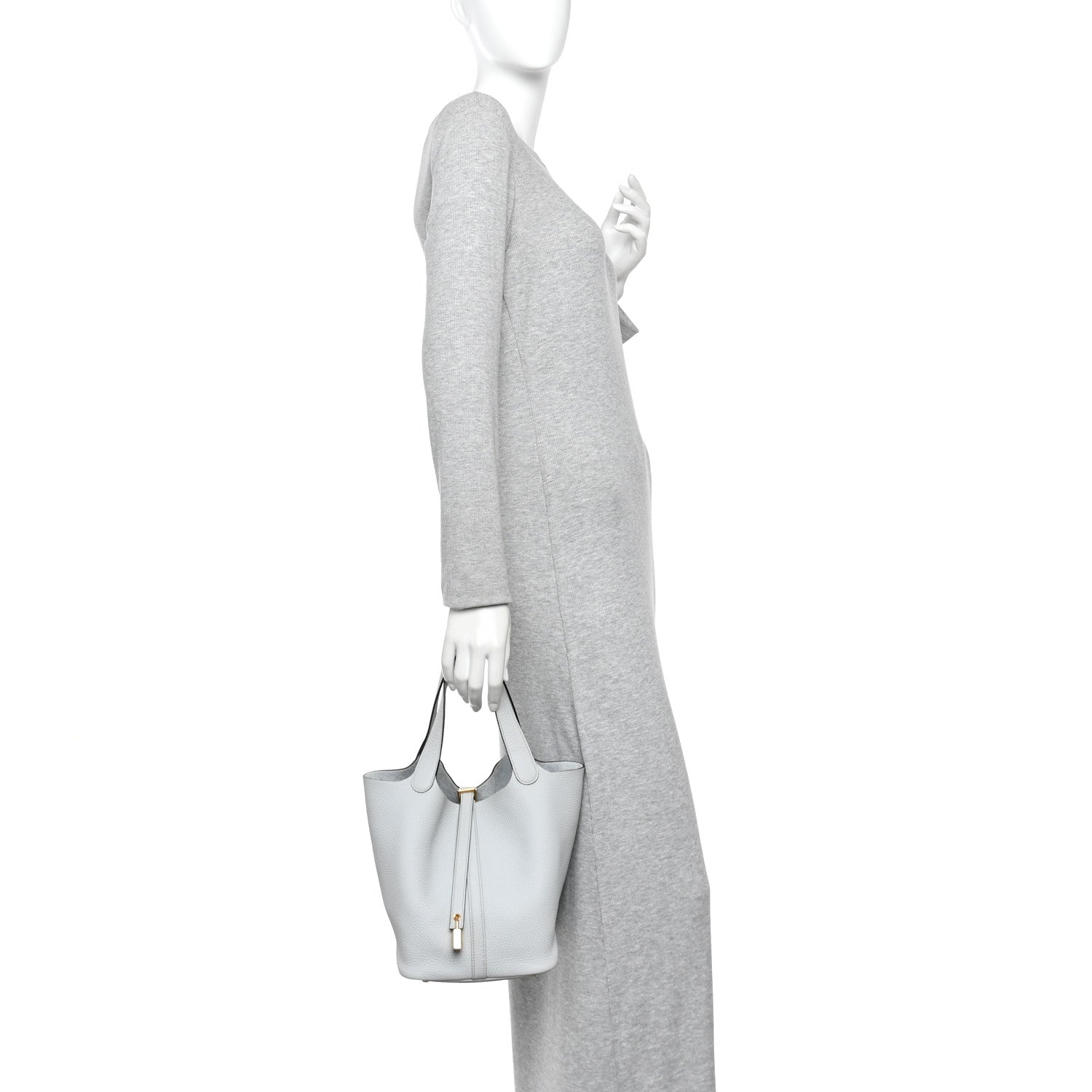 Light blue pebbled leather bucket tote with short handles and lock front