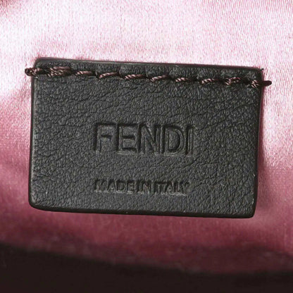 Mini baguette handbag front label with embossed FENDI text and MADE IN ITALY
