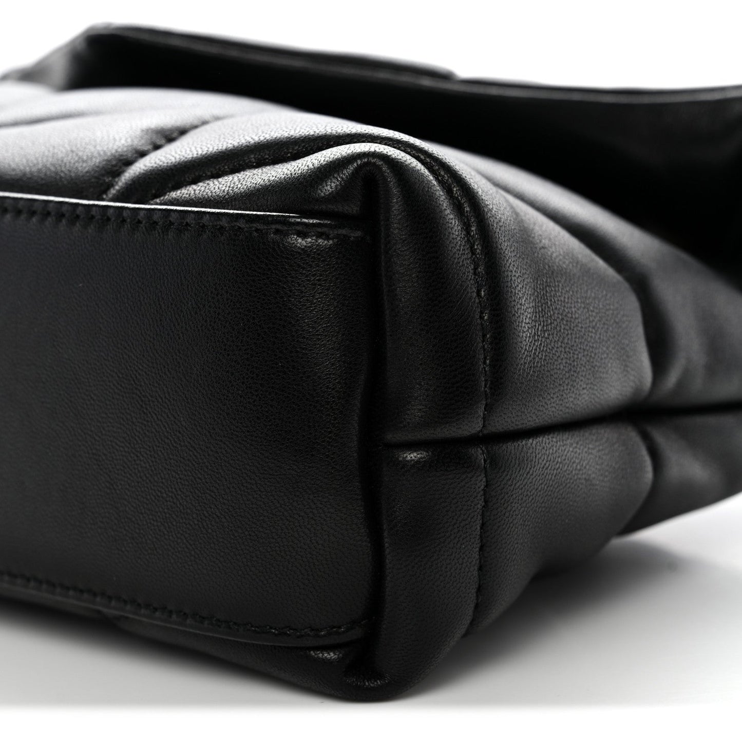 Saint Laurent quilted lambskin satchel edge close-up with black leather panel
