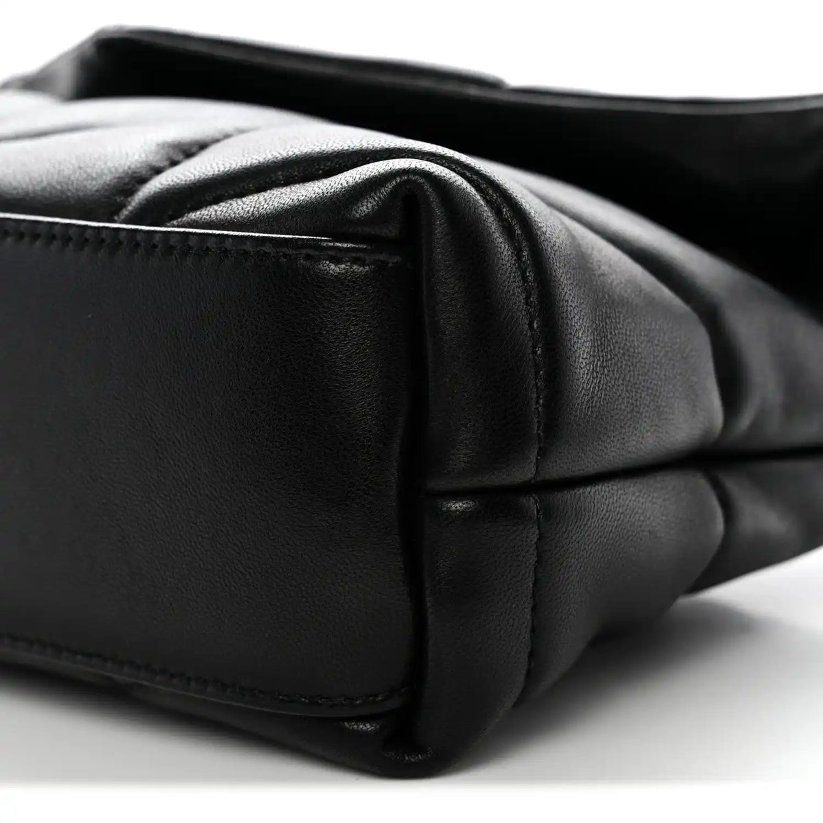 Saint Laurent quilted lambskin satchel edge close-up with black leather panel