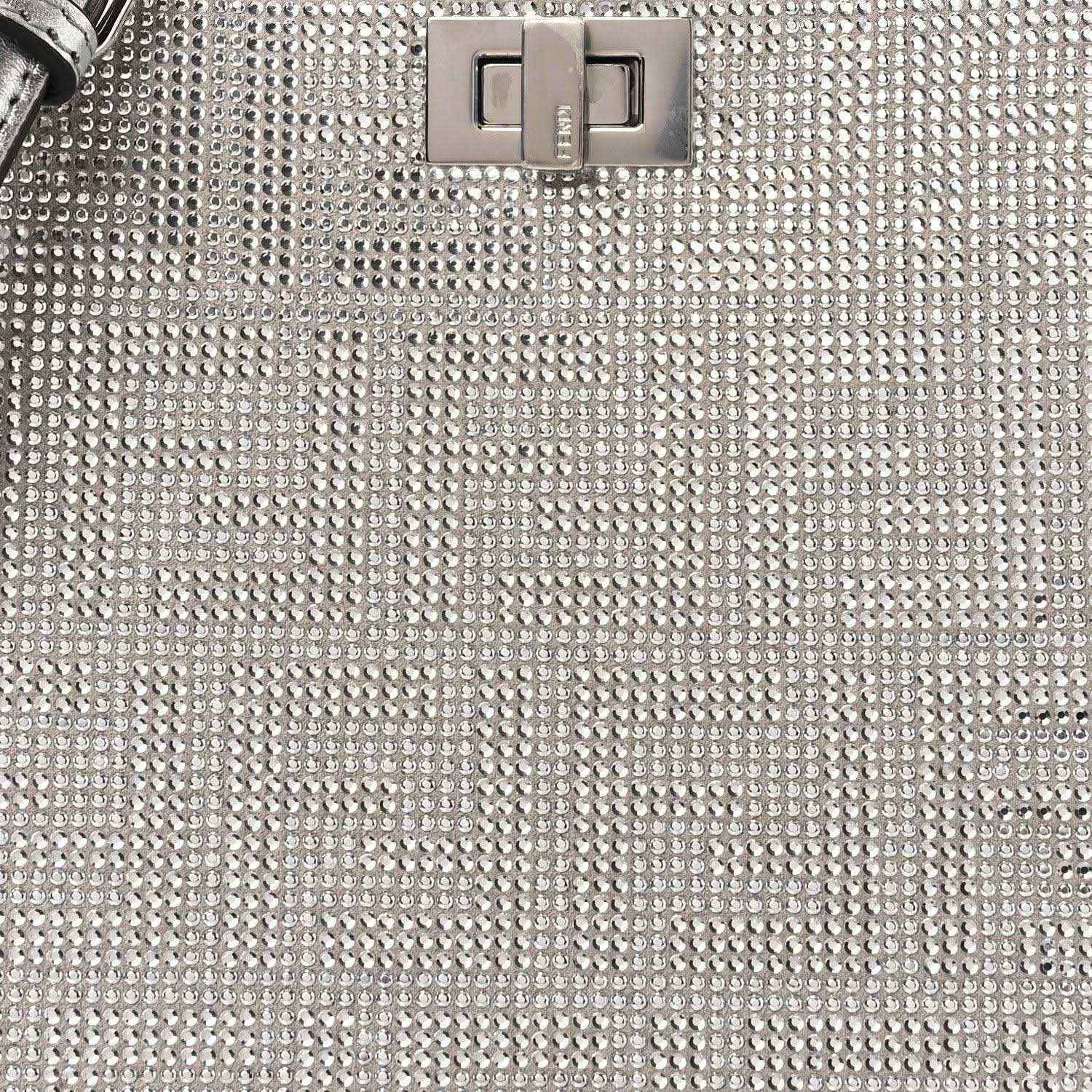 Silver crystal leather front panel with central logo clasp