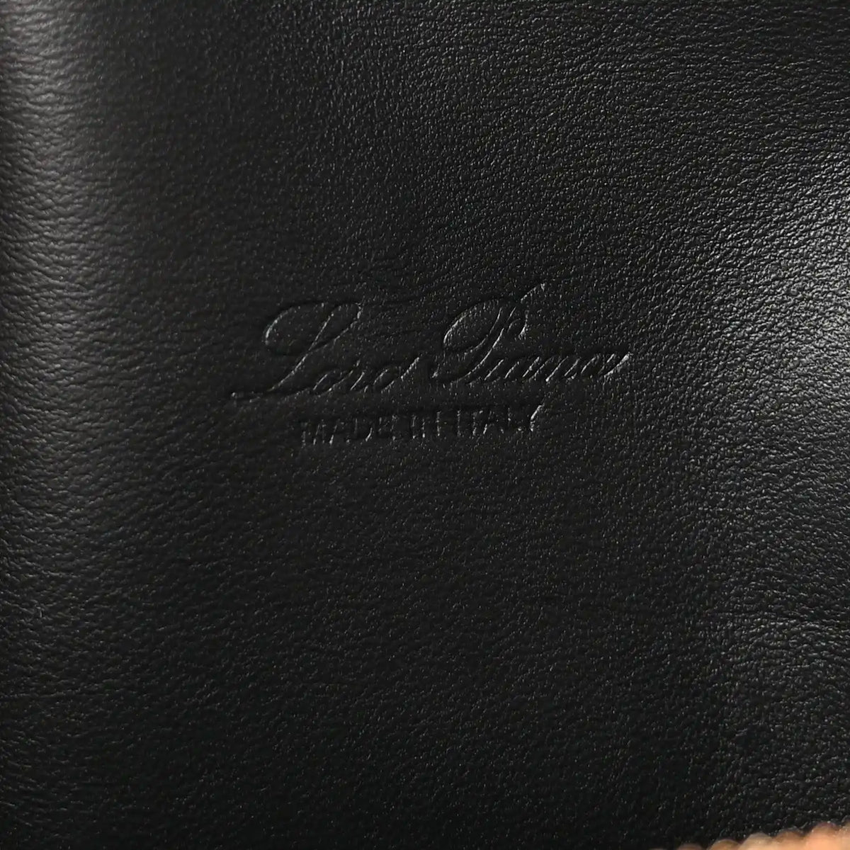 Loro Piana embossed logo on black grained calfskin pouch