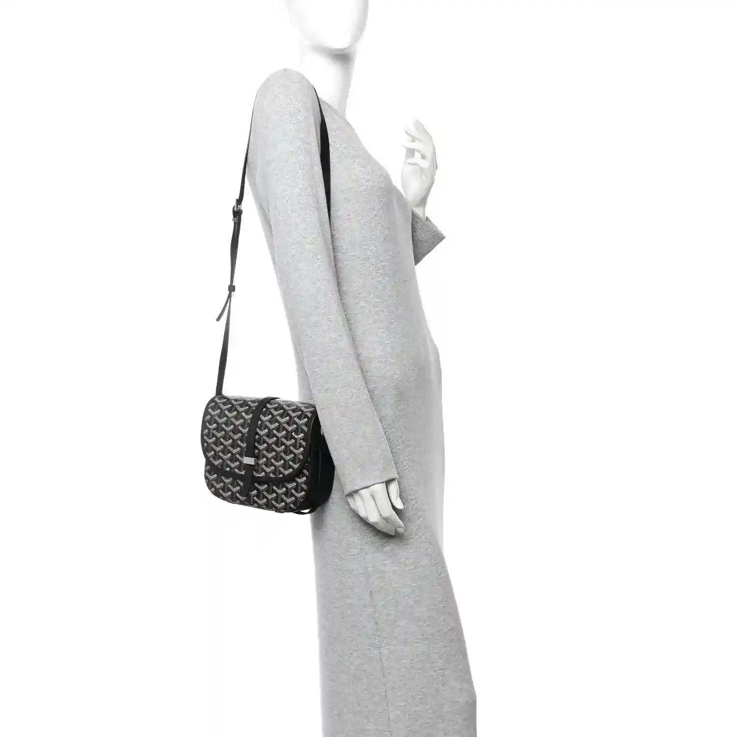 Black jacquard mini messenger bag worn crossbody on a person, adjustable strap