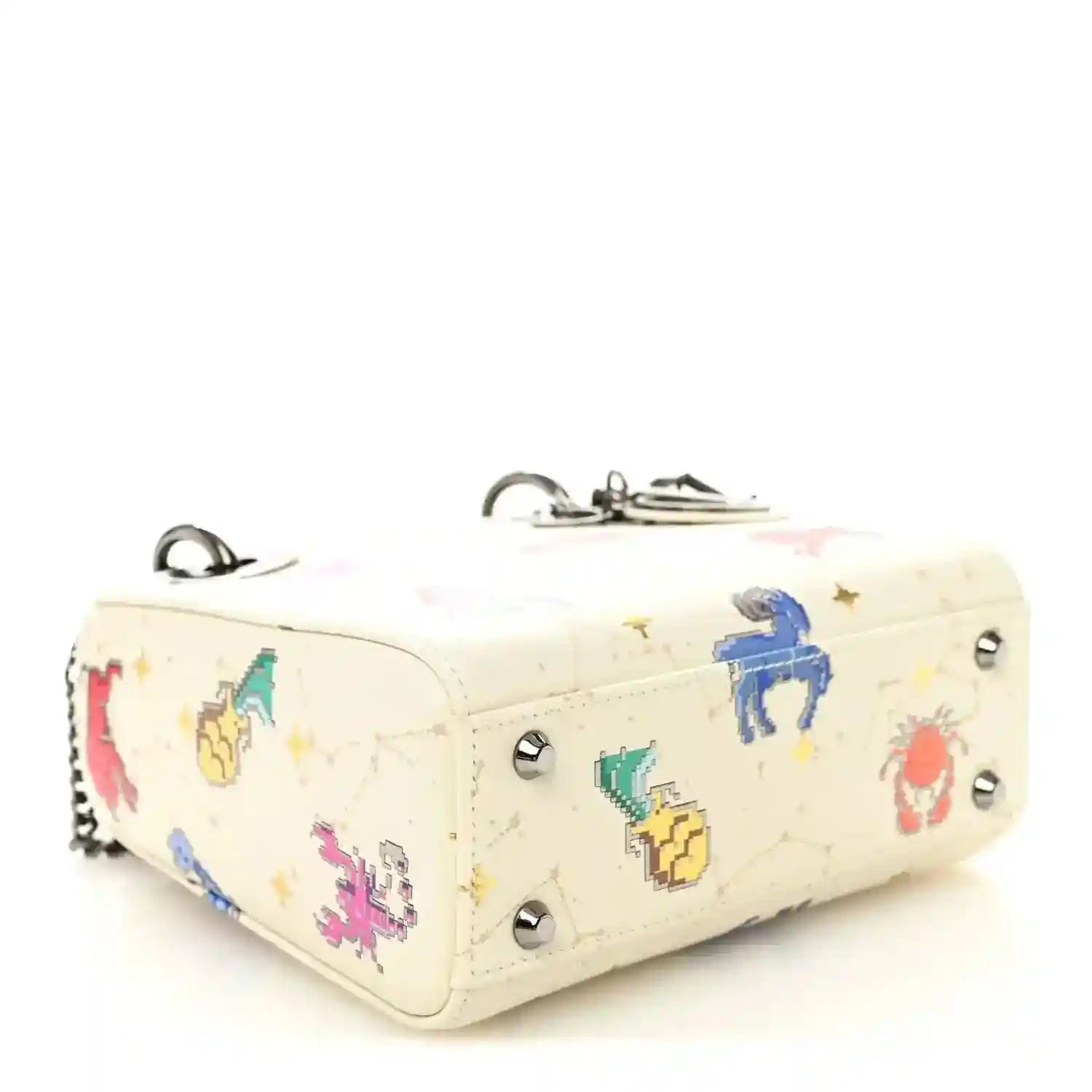 Mini Lady Dior bag side view in white pixel zodiac leather with silver studs