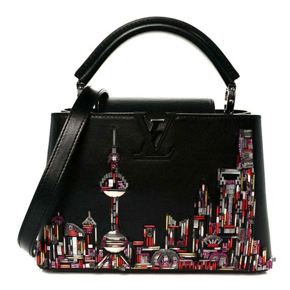 Capucines BB black calfskin beaded skyline bag with top handles and LV emblem