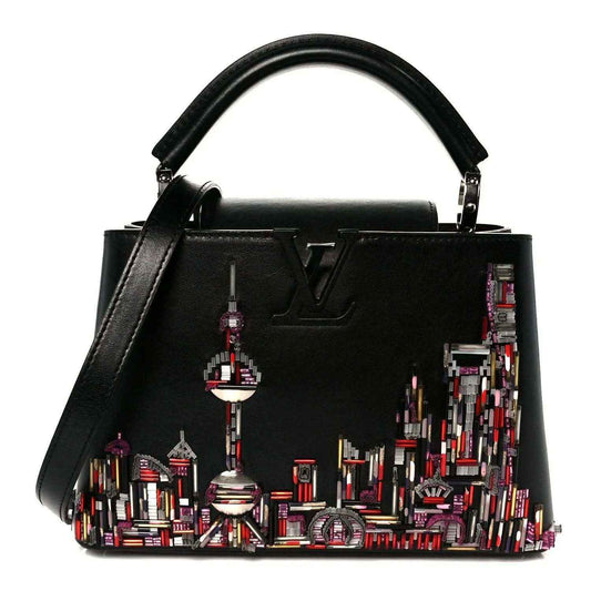 Capucines BB black calfskin beaded skyline bag with top handles and LV emblem