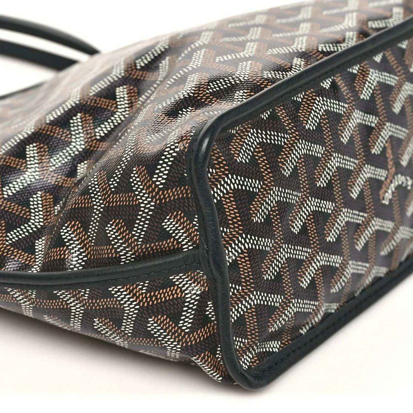 Reversible mini tote bag corner with patterned canvas fabric and black leather trim