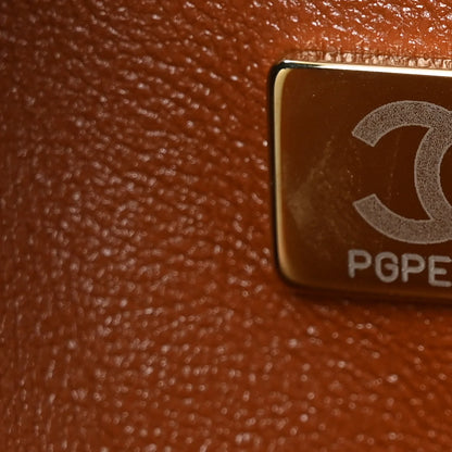 Chanel Jumbo Double Flap bag detail with metal engraving and leather texture close-up