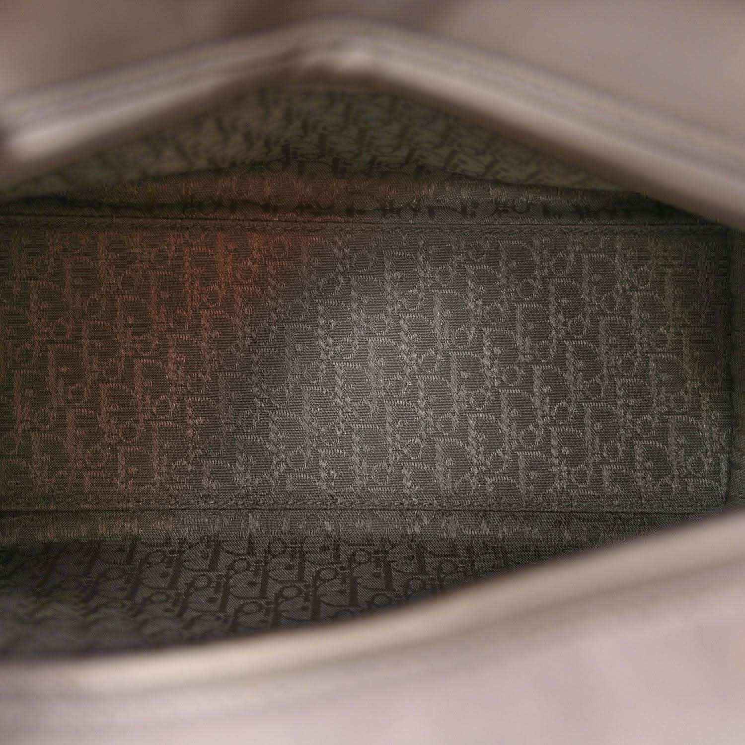 Grey Lady Dior handbag interior lining with repeating pattern near the open top