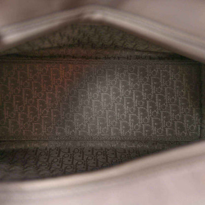 Grey Lady Dior handbag interior lining with repeating pattern near the open top