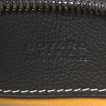 Embossed Goyard logo on dark leather panel