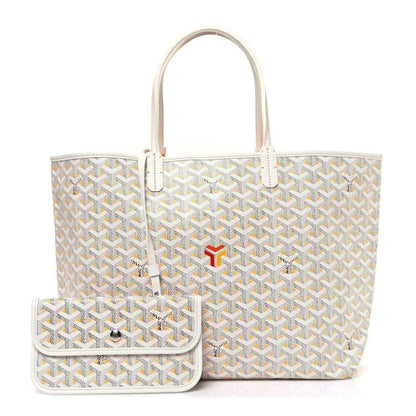 White tote bag with yellow Goyardine pattern and matching small pouch with clasp