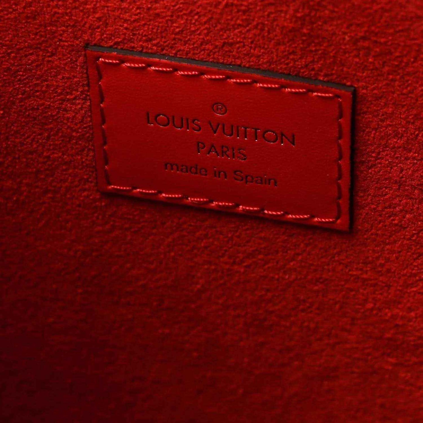 Louis Vuitton Paris made in Spain red leather label on tote bag