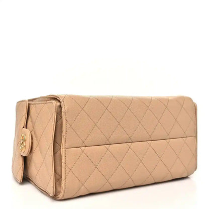 Chanel caviar quilted small 25 handbag in dark beige with top flap and side logo detail