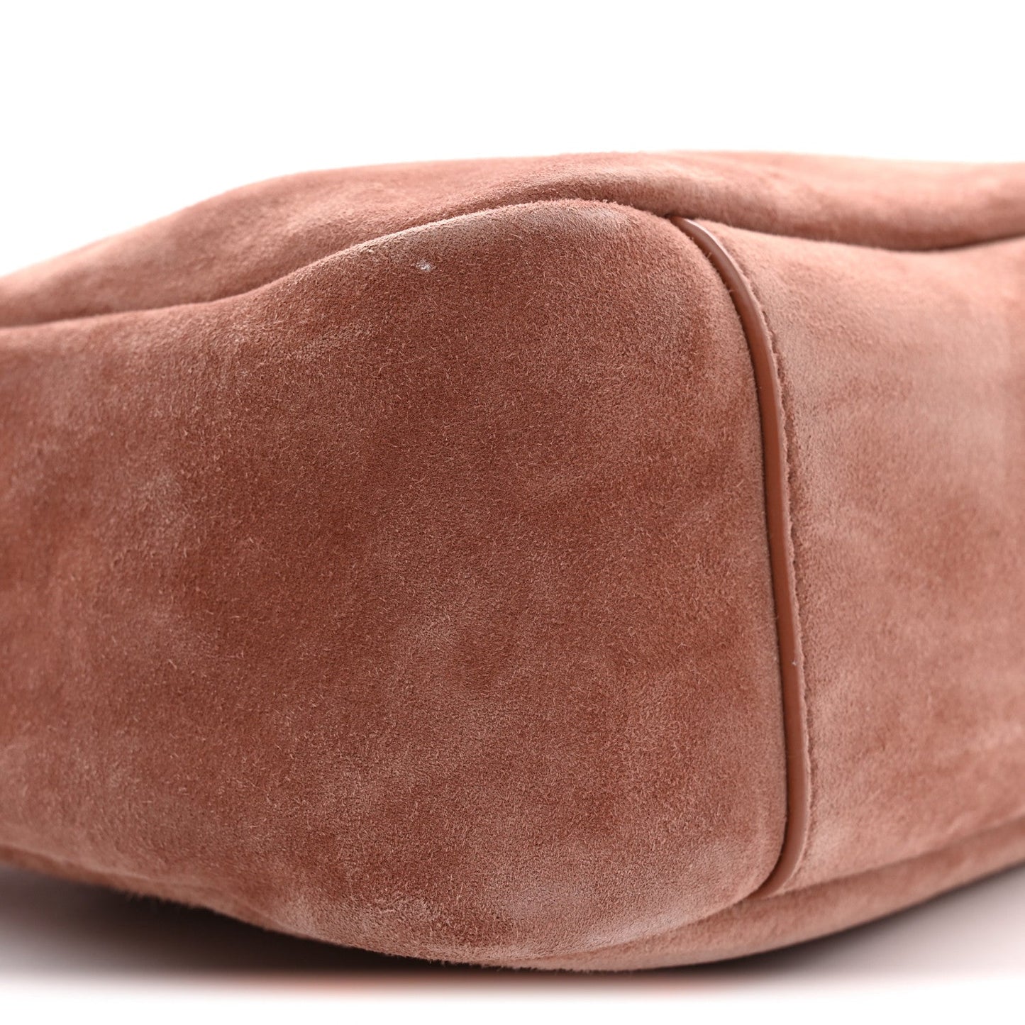 Small suede hobo bag close-up of rounded bottom corner and side seam
