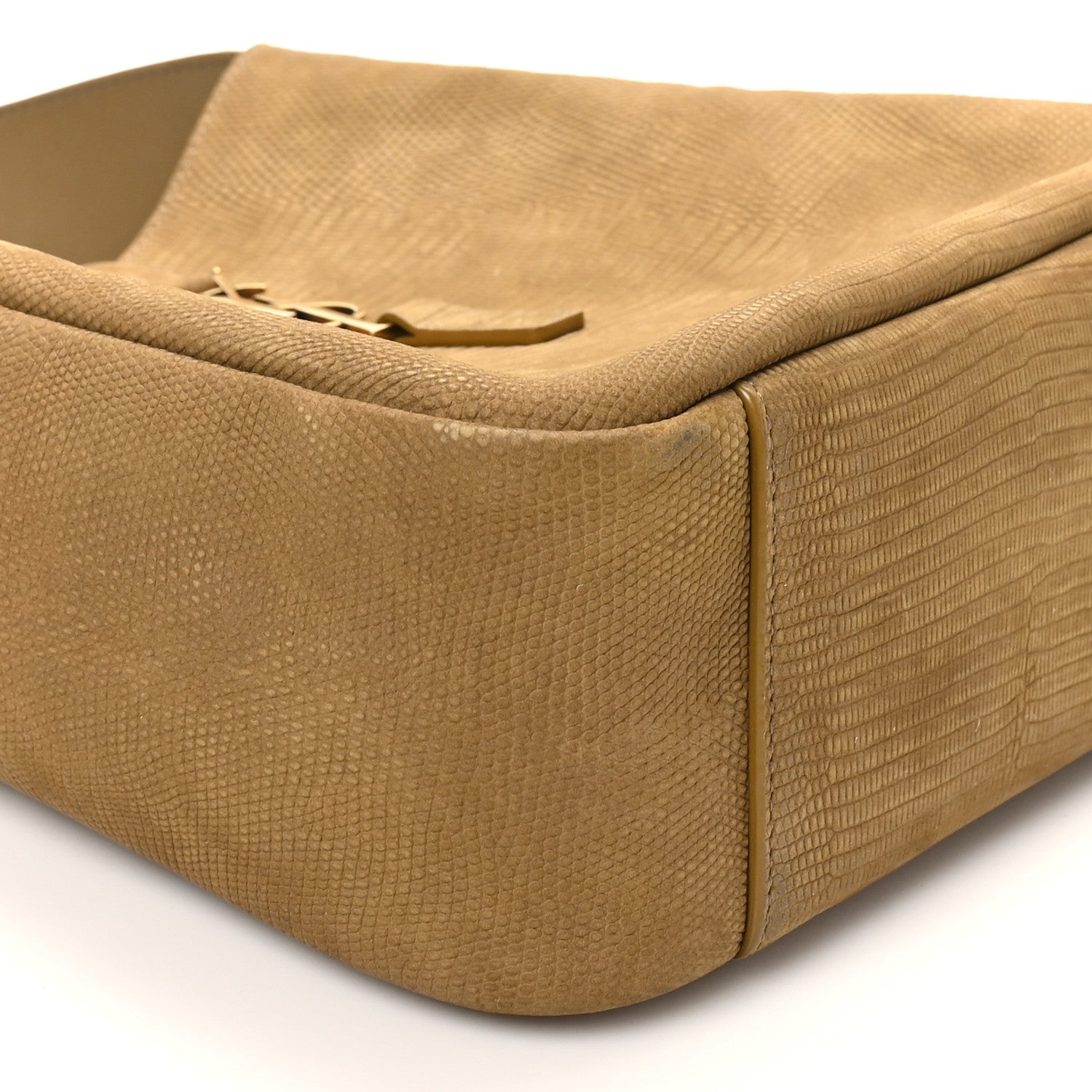 Small hobo bag corner view with lizard-embossed texture and rounded bottom