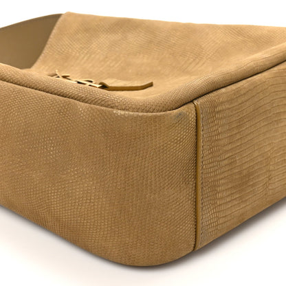 Small hobo bag corner view with lizard-embossed texture and rounded bottom