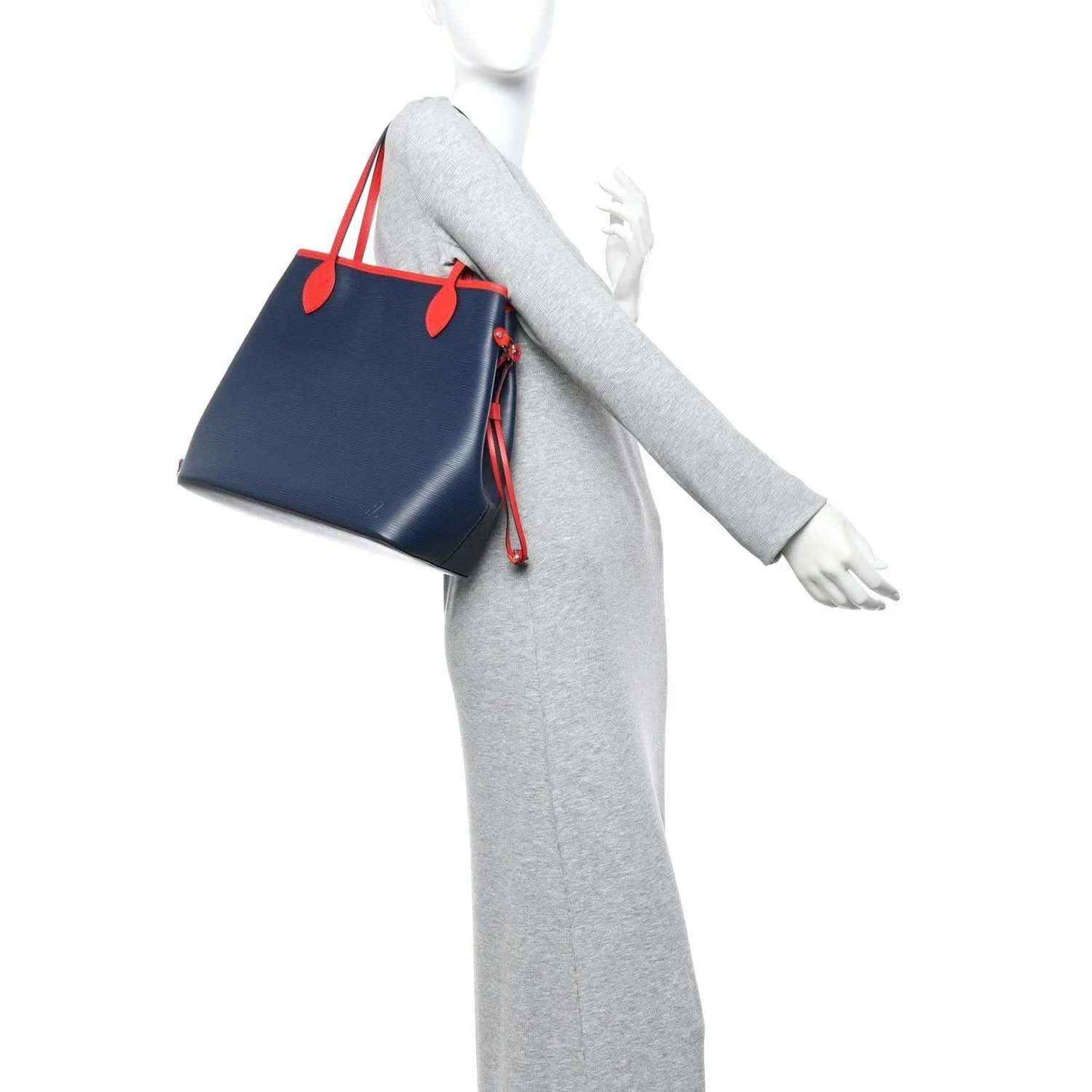 Louis Vuitton Epi Neverfull MM tote bag worn with navy body and red handle accents