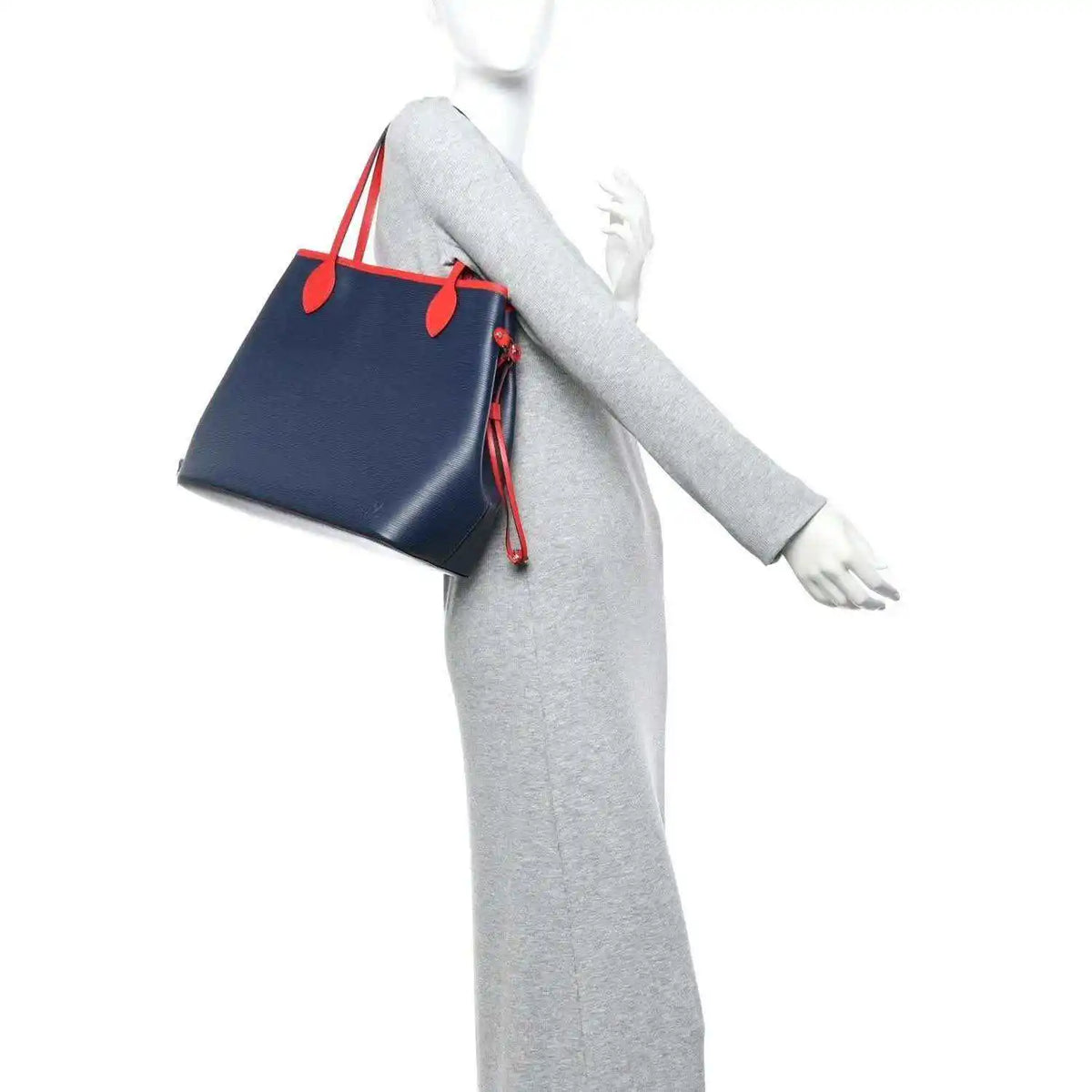 Louis Vuitton Epi Neverfull MM tote bag worn with navy body and red handle accents