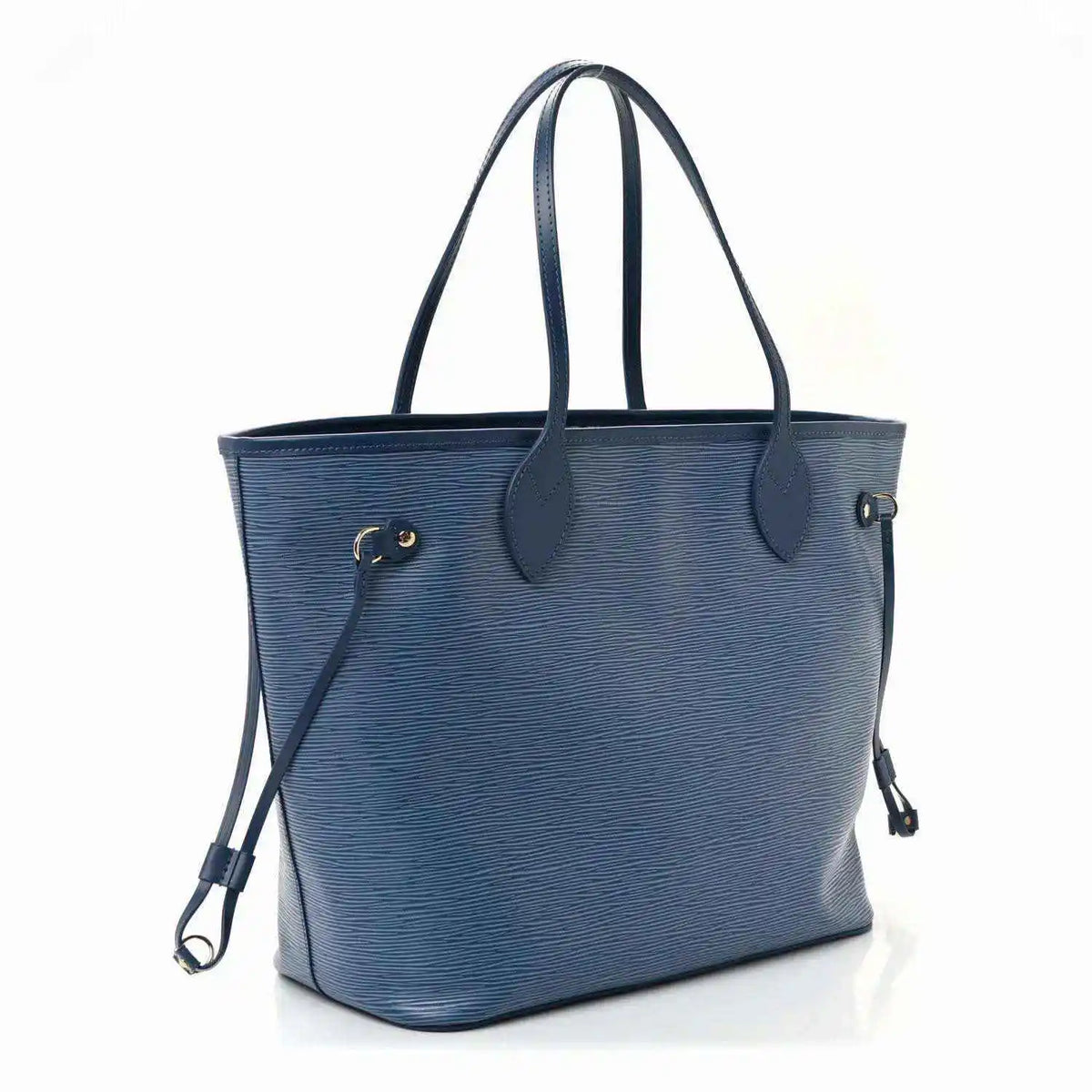 Denim blue leather tote bag with side strap, dual top handles, and gold hardware