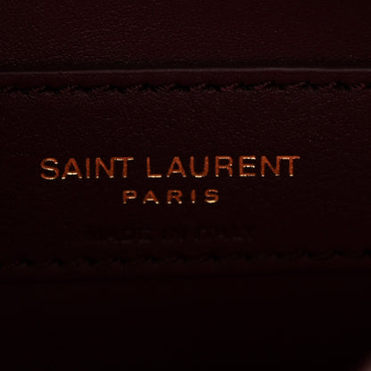 Saint Laurent Paris stamped on burgundy leather lining