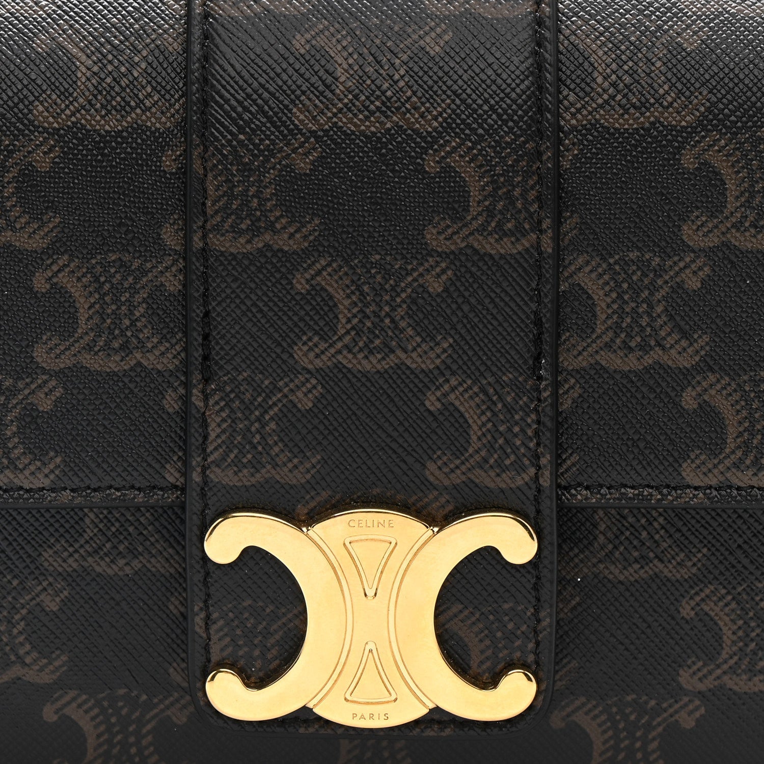 Celine Triomphe shoulder bag front close-up with gold CD clasp on dark brown canvas