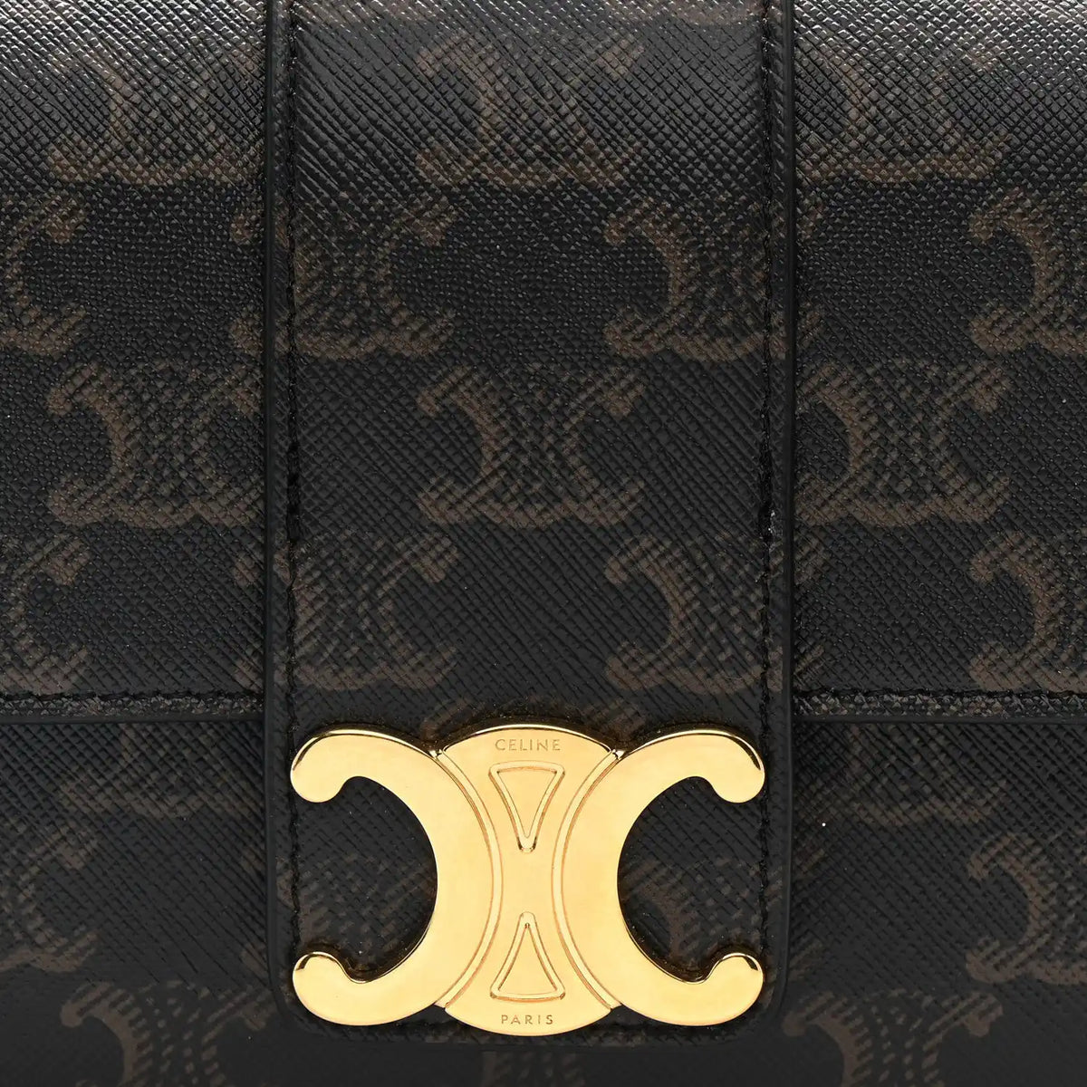 Celine Triomphe shoulder bag front close-up with gold CD clasp on dark brown canvas