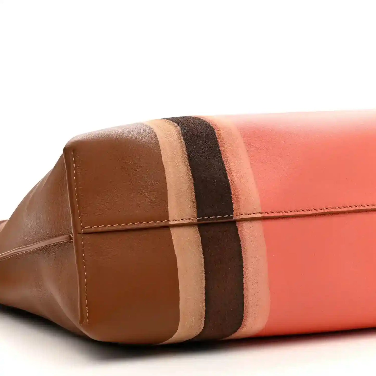 Flamenco knot clutch end panel close-up with brown leather, coral section, and stripes
