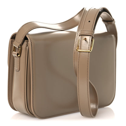 Medium Celine shoulder bag with adjustable strap, structured shiny beige leather and gold hardware