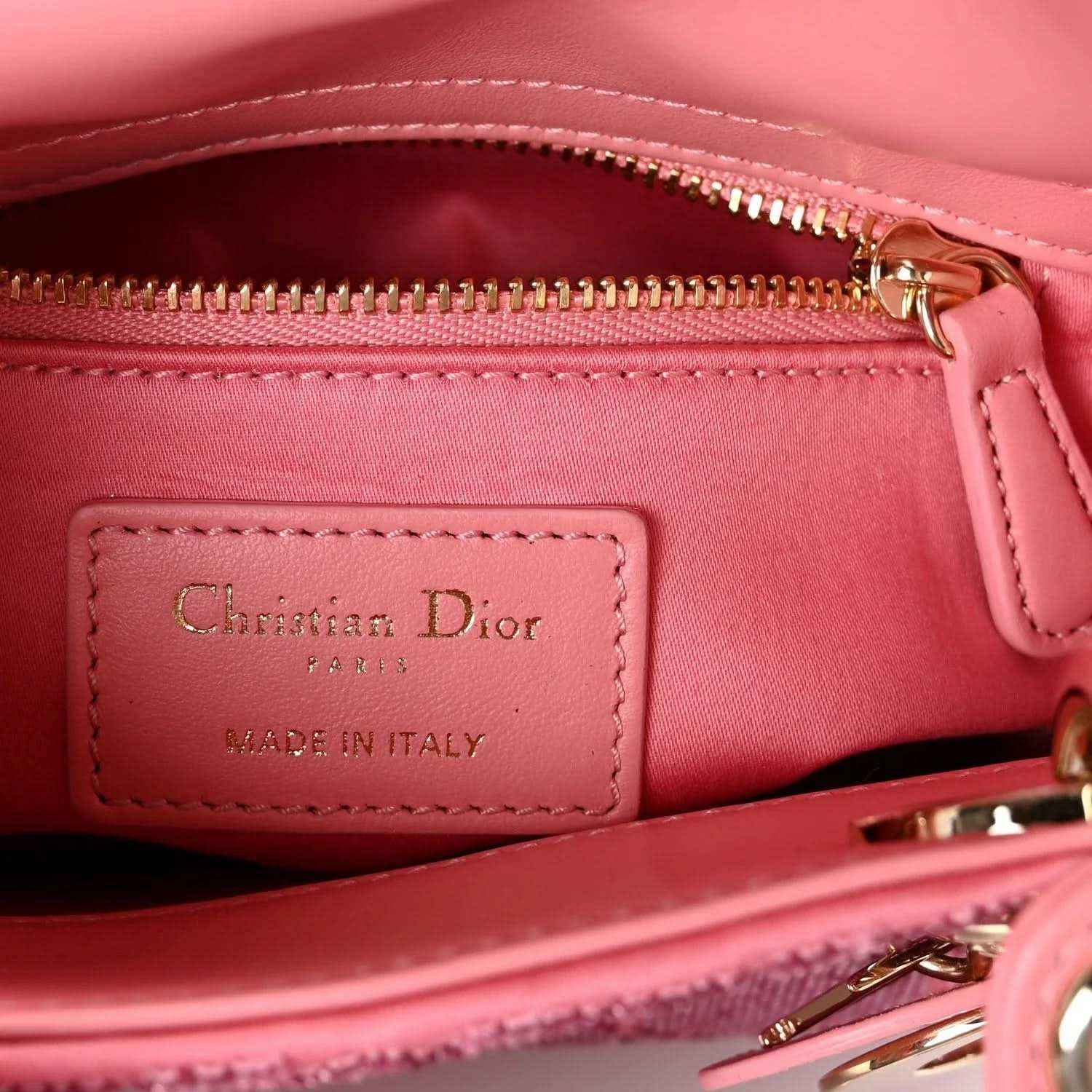 Mini Lady Dior handbag interior closeup with Dior label and zip hardware