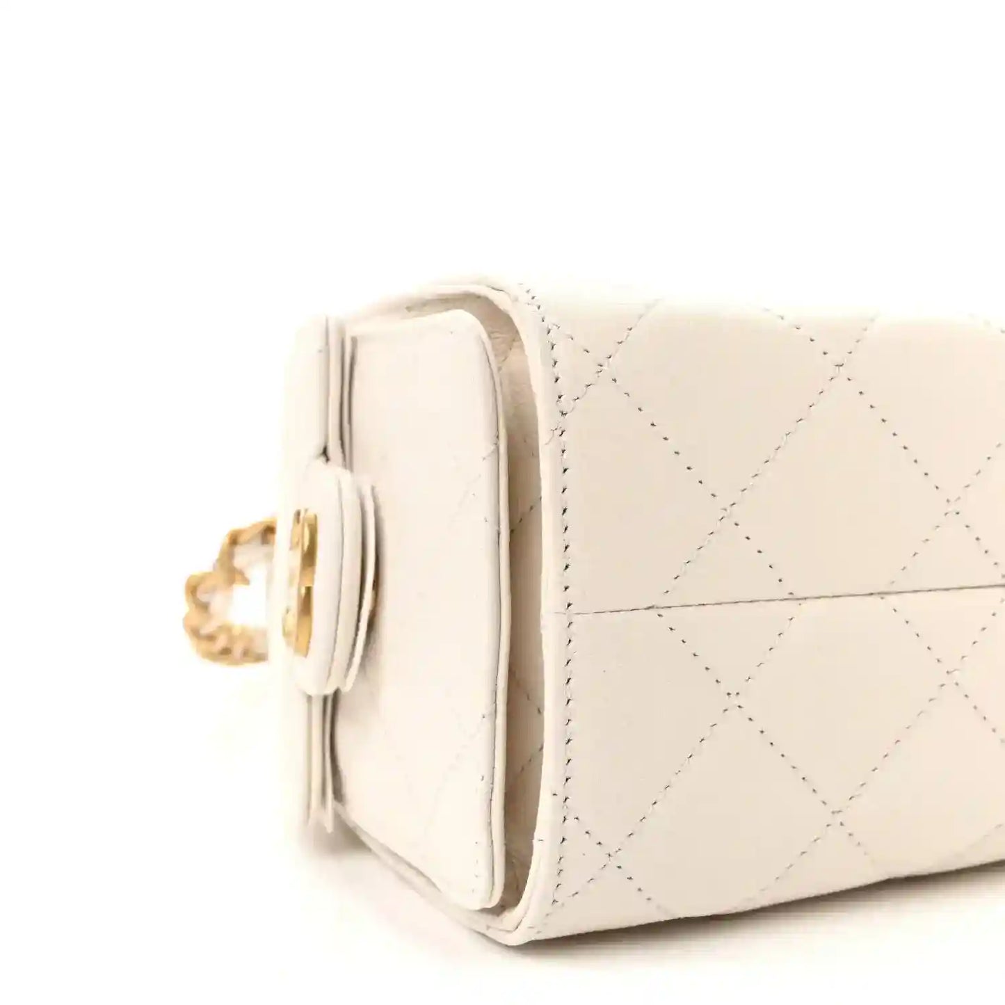 White quilted leather mini handbag side view with stacked pocket and gold-tone chain hardware