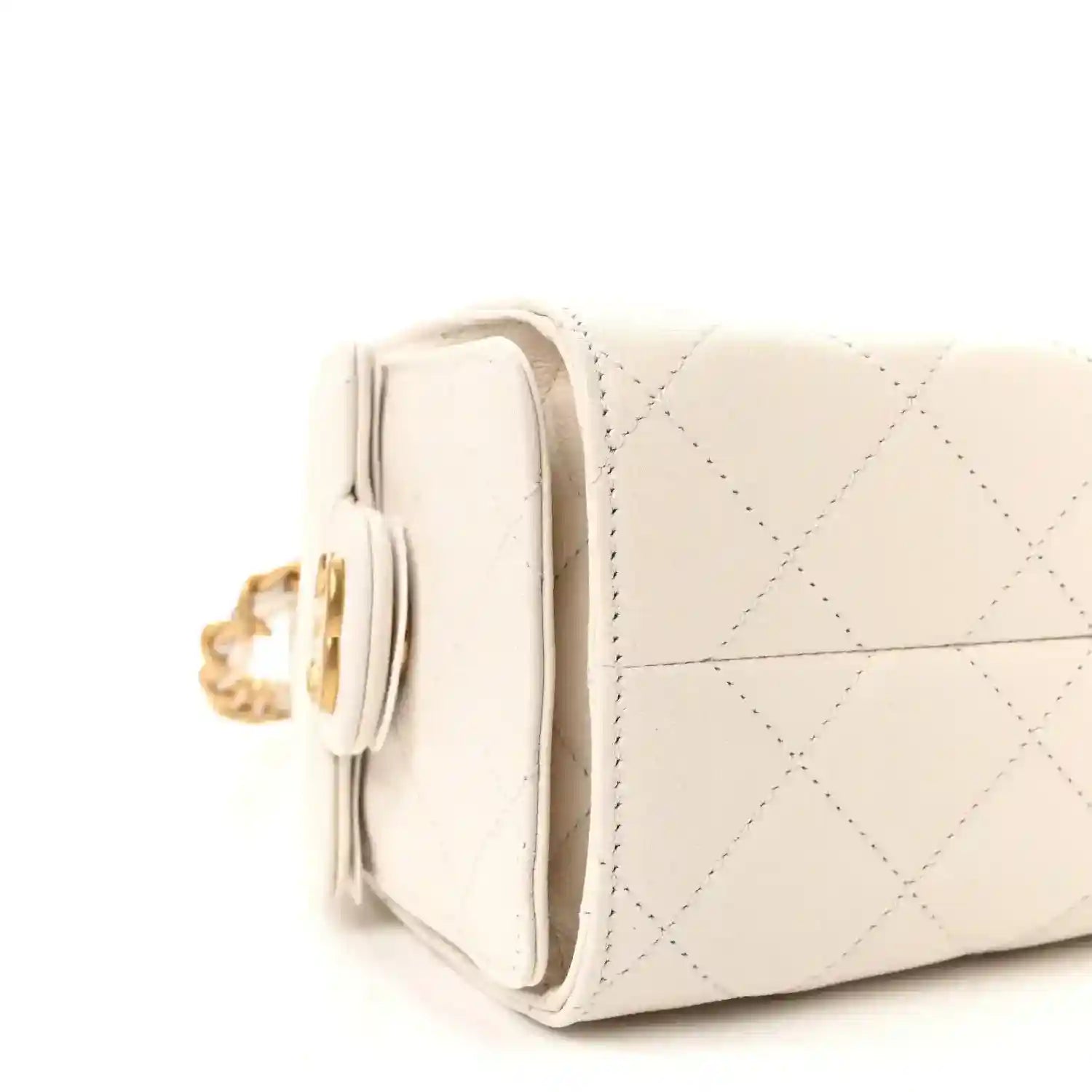 White quilted leather mini handbag side view with stacked pocket and gold-tone chain hardware