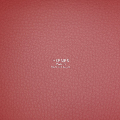 Mauve textured leather handbag interior with stamped brand markings