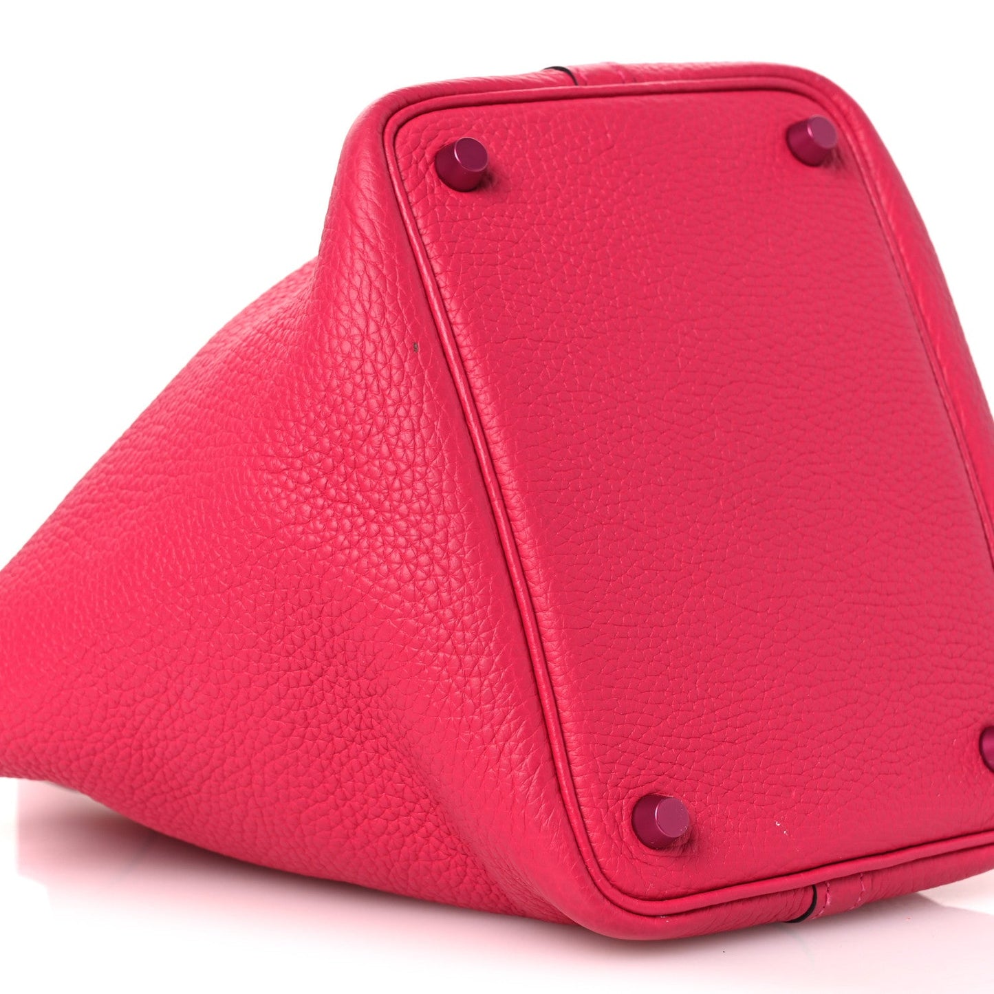 Rose pink leather bucket tote with top corner eyelets and strap