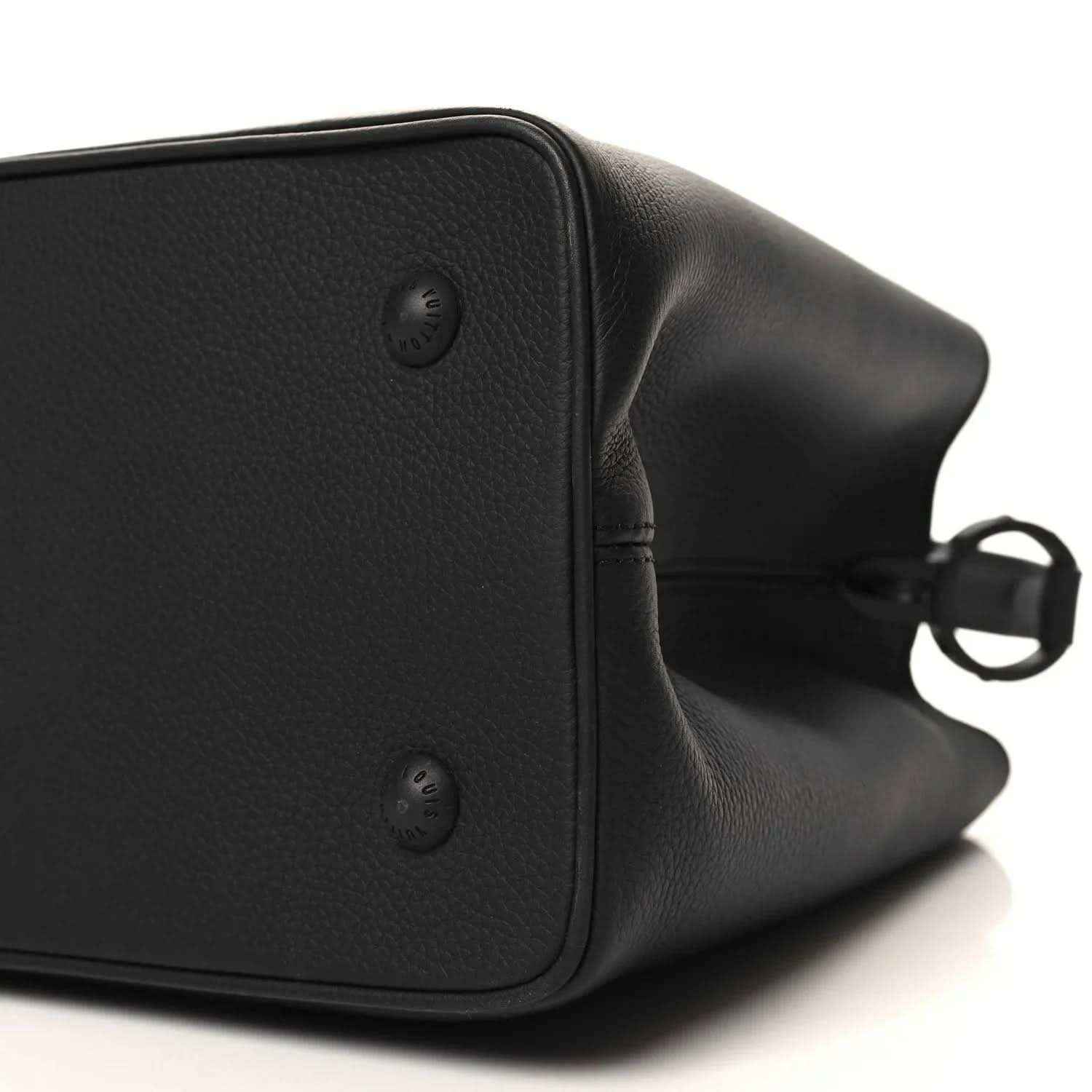 Black matte leather handbag side with studs and strap hardware detail