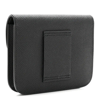 Black leather slim wallet with embossed square panel on back.