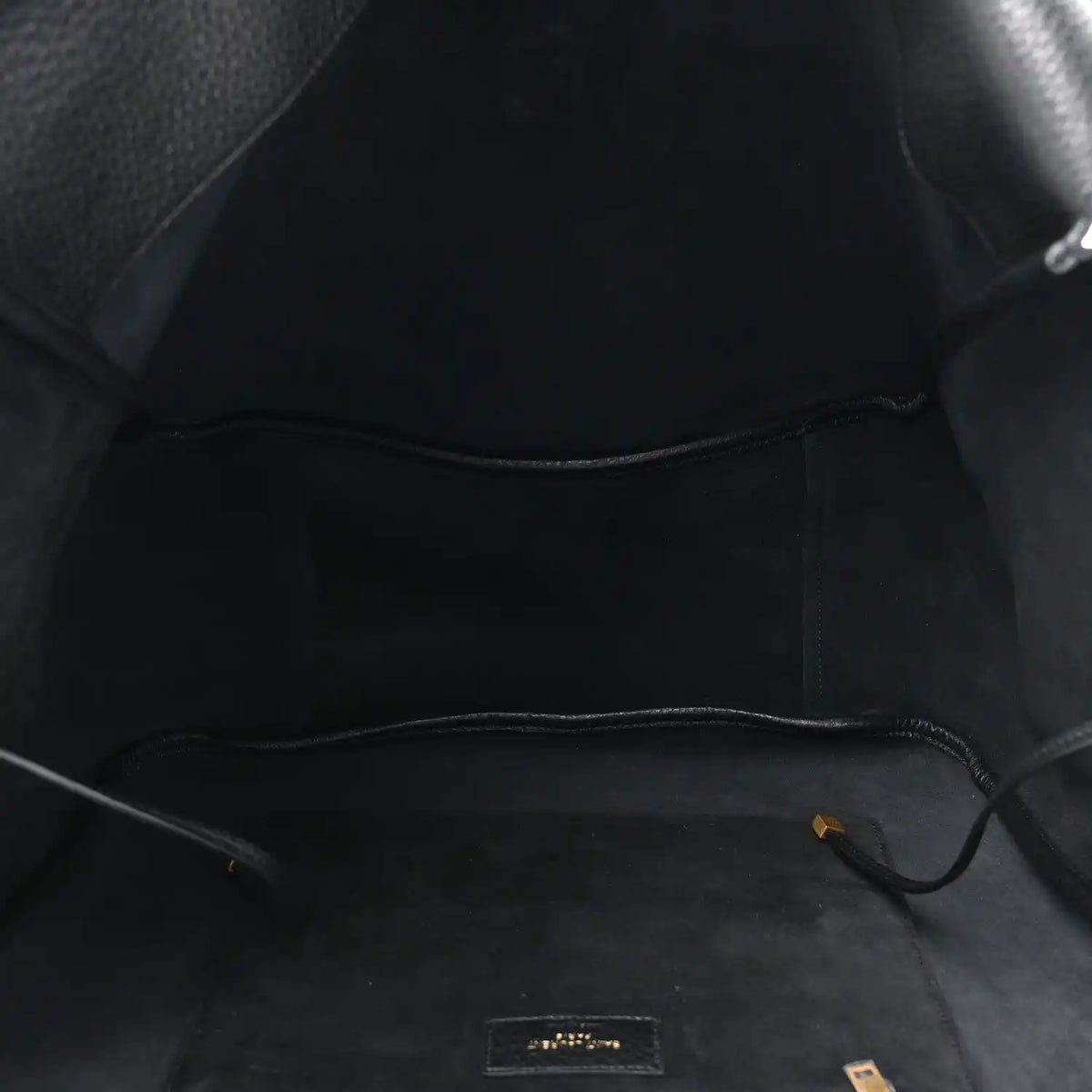 Black leather Bea tote interior with central seam and small logo patch