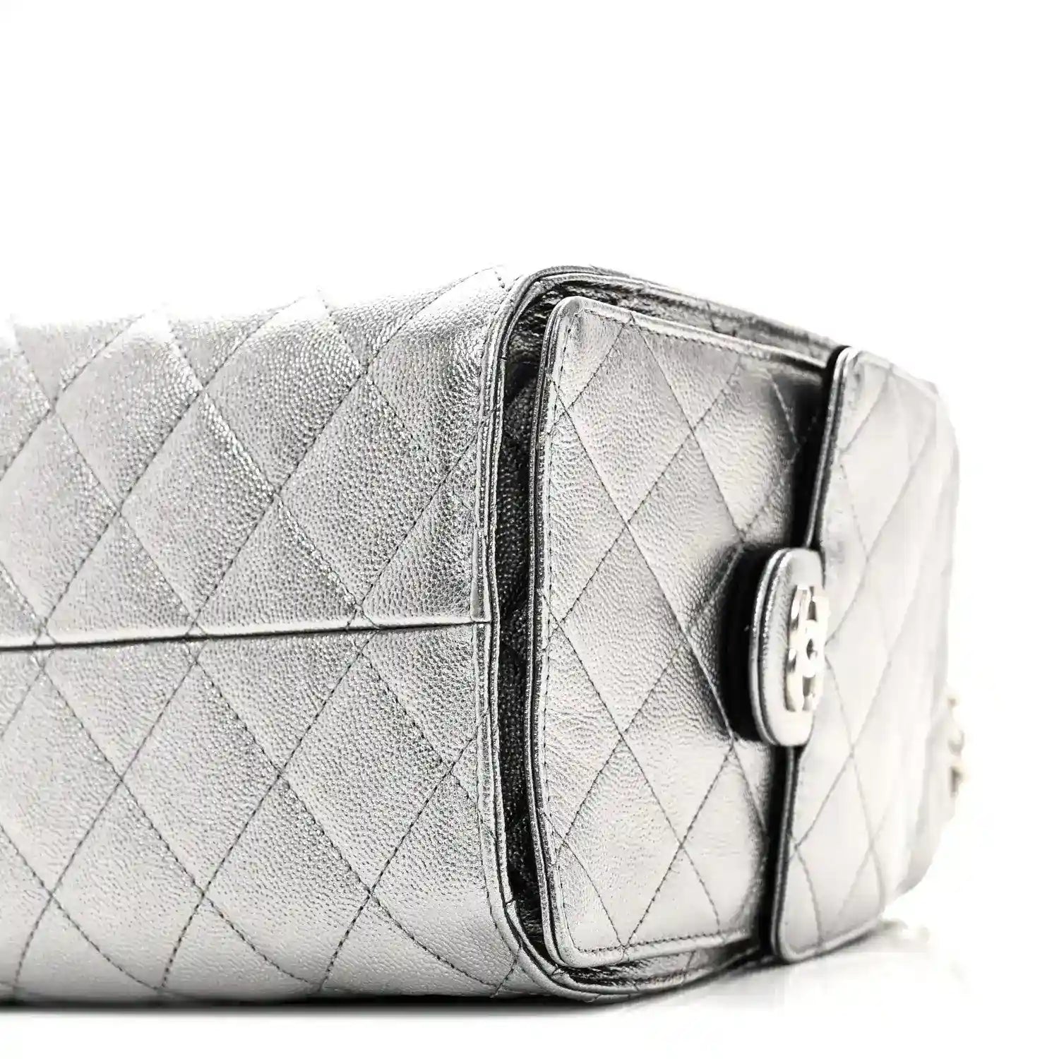 Chanel metallic quilted handbag side with zipper tab and silver chain strap