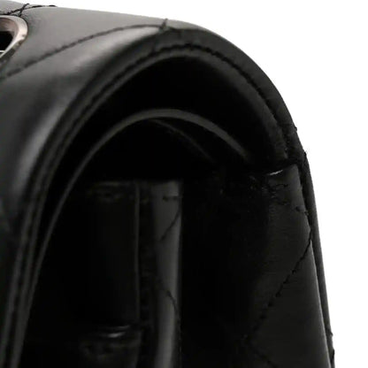Chanel small double flap bag, open interior showing stitched flap and dark lining